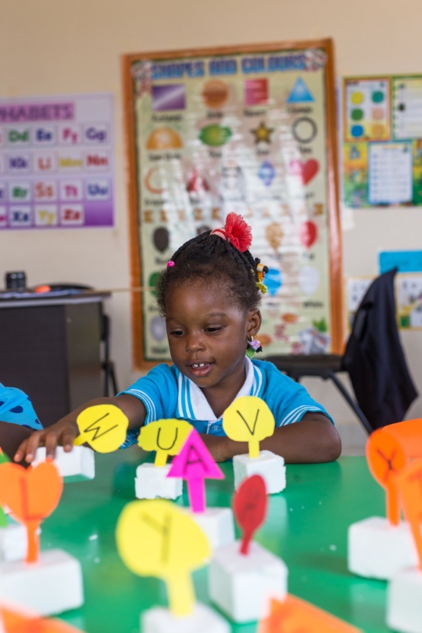 Pupil building letters at The Learning Place