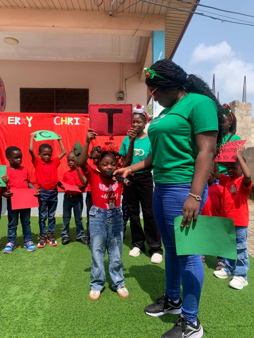 A pupil takes the microphone at a school performance